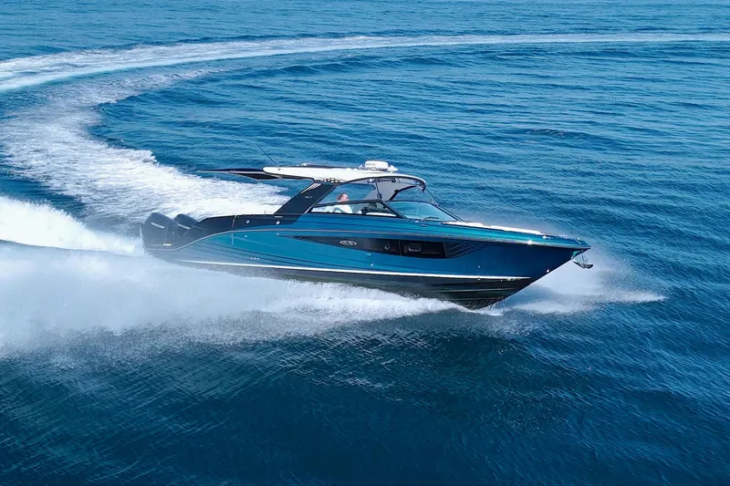 Slide: The Image of 2021 Sea Ray SLX 400 Outboard cruising swiftly on open blue waters. - 11