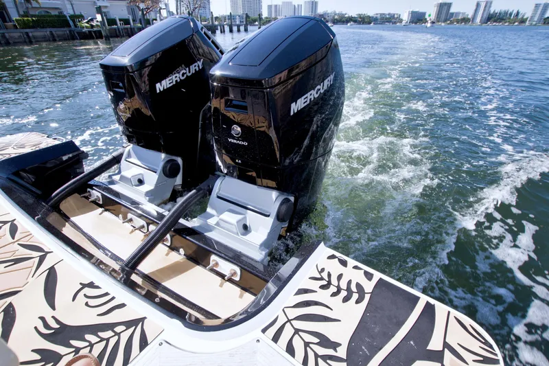 Slide: The Image of 2021 Sea Ray SLX 400 Outboard with dual Mercury engines on water. - 15