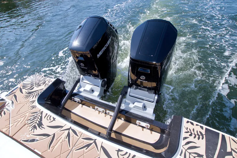 Slide: The Image of 2021 Sea Ray SLX 400 Outboard with twin Mercury engines on water. - 16