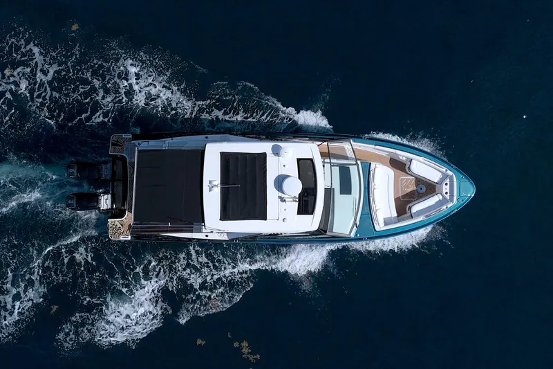 Slide: The Image of Aerial view of 2021 Sea Ray SLX 400 Outboard cruising on open water. - 2