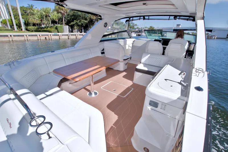 Slide: The Image of Luxurious 2021 Sea Ray SLX 400 Outboard boat interior with spacious seating and elegant design. - 20