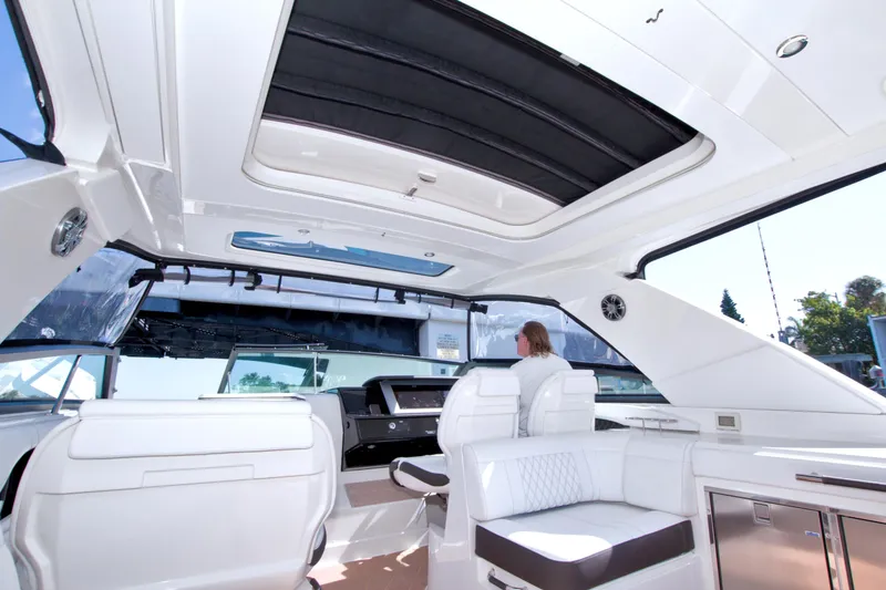 Slide: The Image of Interior view of 2021 Sea Ray SLX 400 Outboard luxury boat with seating and helm. - 26