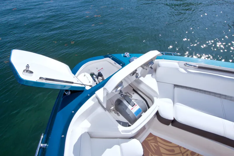 Slide: The Image of 2021 Sea Ray SLX 400 Outboard boat with open storage compartment on water. - 35
