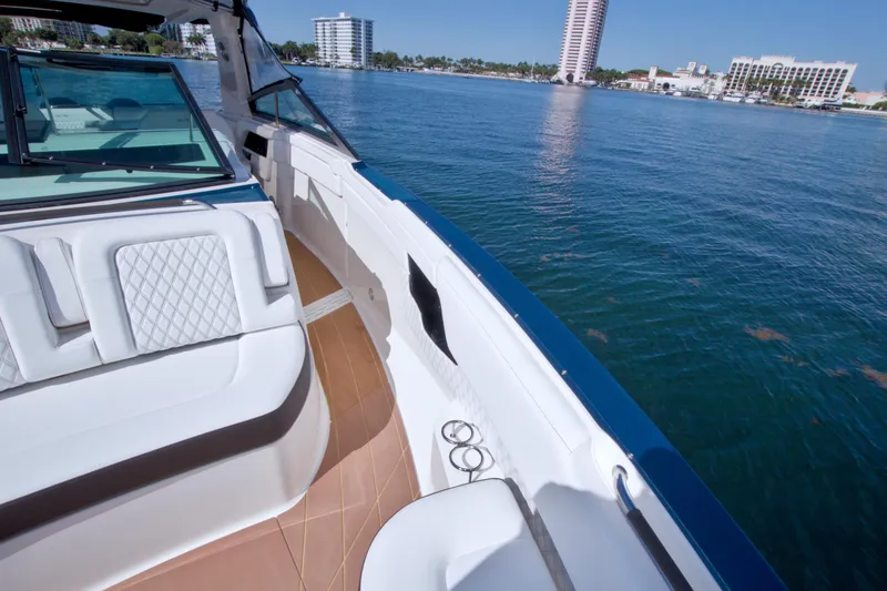 Slide: The Image of 2021 Sea Ray SLX 400 Outboard boat interior with waterfront cityscape view. - 37