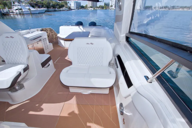 Slide: The Image of Luxurious interior of 2021 Sea Ray SLX 400 Outboard yacht with white seating and scenic water view. - 39