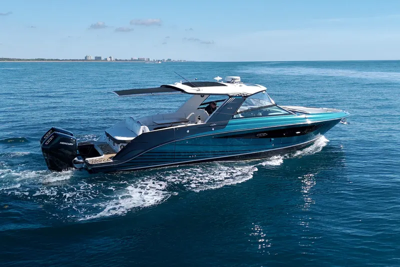 Slide: The Image of 2021 Sea Ray SLX 400 Outboard cruising on open water under clear skies. - 4