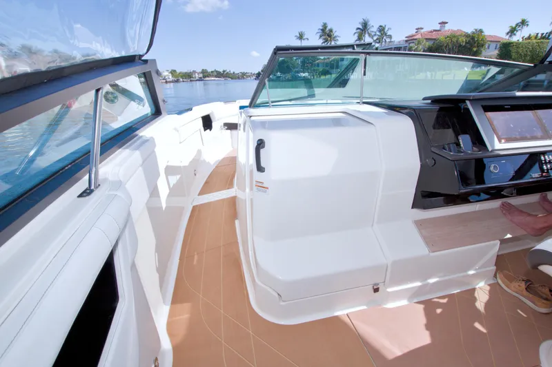 Slide: The Image of Interior view of 2021 Sea Ray SLX 400 Outboard boat with modern dashboard and seating. - 41