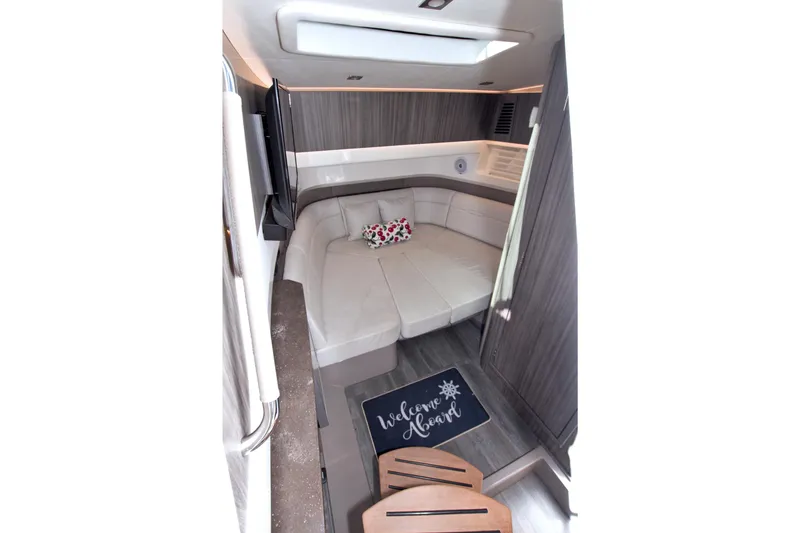Slide: The Image of Interior of 2021 Sea Ray SLX 400 Outboard, featuring cozy seating and modern design. - 43