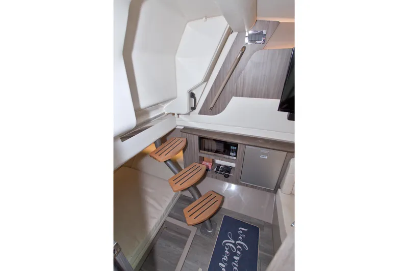 Slide: The Image of Interior of 2021 Sea Ray SLX 400 Outboard, featuring modern cabin amenities. - 44
