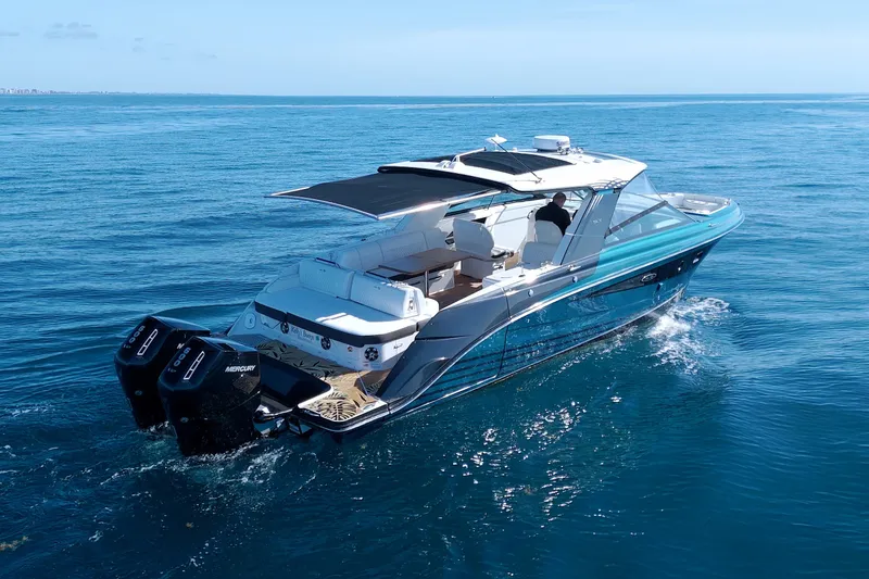 Slide: The Image of 2021 Sea Ray SLX 400 Outboard cruising on open water, showcasing luxury and performance. - 5