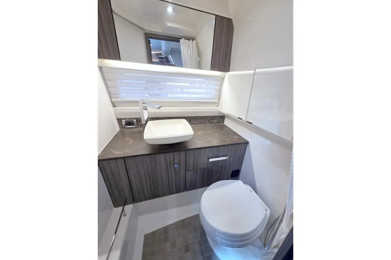 Slide: The Image of Luxurious bathroom interior of 2021 Sea Ray SLX 400 Outboard yacht, featuring modern fixtures. - 51