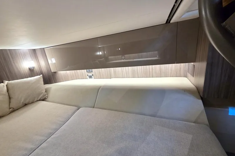 Slide: The Image of Interior cabin of 2021 Sea Ray SLX 400 Outboard with modern design and comfortable seating. - 54