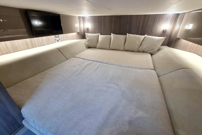 Slide: The Image of Luxurious interior cabin of 2021 Sea Ray SLX 400 Outboard with plush seating and TV. - 55