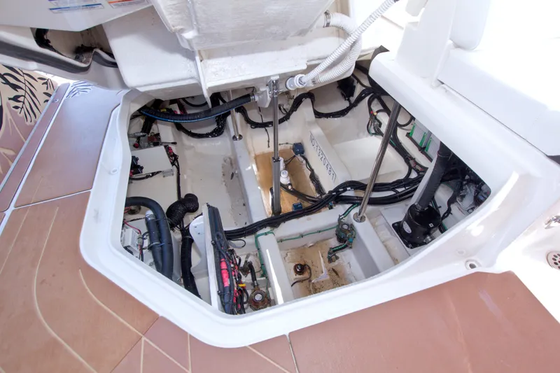 Slide: The Image of Engine compartment of 2021 Sea Ray SLX 400 Outboard, showcasing wiring and mechanical components. - 59