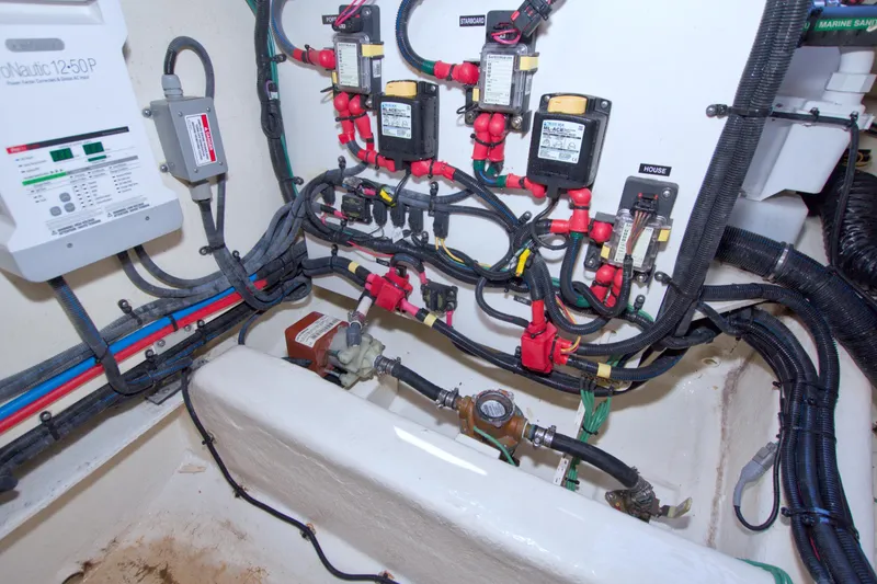 Slide: The Image of Electrical wiring and components inside a 2021 Sea Ray SLX 400 Outboard boat. - 60