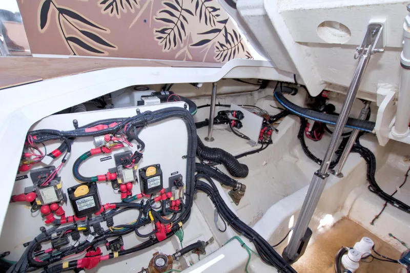Slide: The Image of Engine compartment of 2021 Sea Ray SLX 400 Outboard with wiring and components visible. - 61