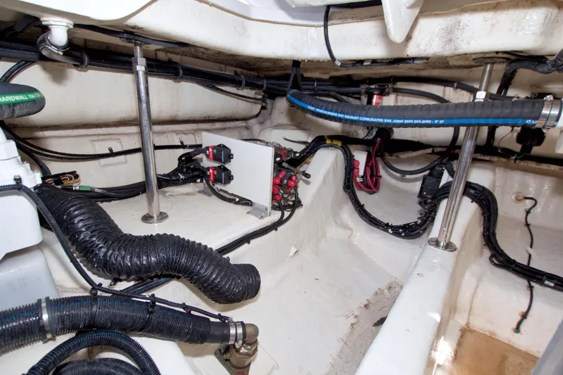 Slide: The Image of Engine compartment of 2021 Sea Ray SLX 400 Outboard, showcasing wiring and hoses. - 62