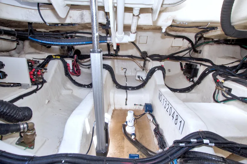 Slide: The Image of Engine compartment of a 2021 Sea Ray SLX 400 Outboard, showcasing wiring and components. - 63
