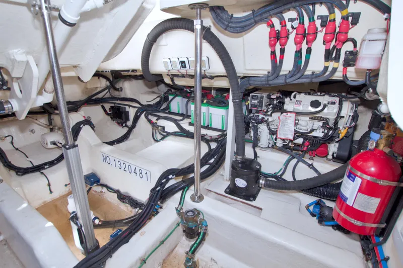 Slide: The Image of Engine compartment of 2021 Sea Ray SLX 400 Outboard with wiring and equipment. - 65