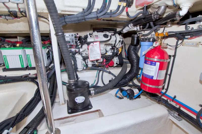Slide: The Image of Engine compartment of 2021 Sea Ray SLX 400 Outboard with fire extinguisher and wiring. - 66