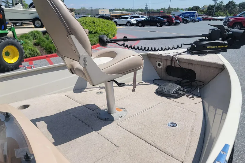 Slide: The Image of 2009 Smoker Craft Pro Angler 161 boat interior with seat and trolling motor. - 8