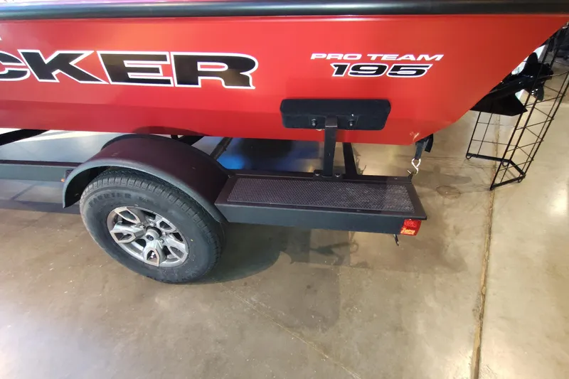 Slide: The Image of Red 2026 Tracker Pro Team 195 boat on trailer, showcasing rear design and wheel. - 5