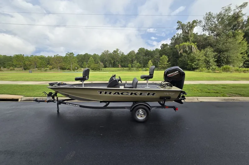 The Image of 2026 Tracker Pro Team 175 Crappie Edition boat on trailer, parked outdoors. - 0