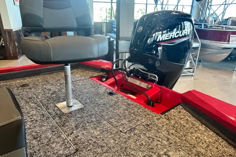 Slide: The Image of 2026 Tracker Pro Team 175 boat interior with Mercury engine and seating. - 11