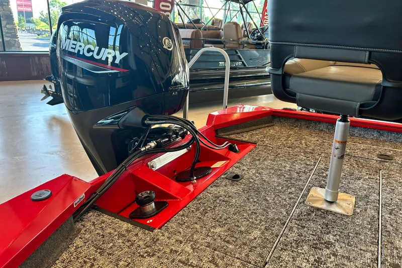 Slide: The Image of 2026 Tracker Pro Team 175 boat with Mercury engine in showroom. - 5