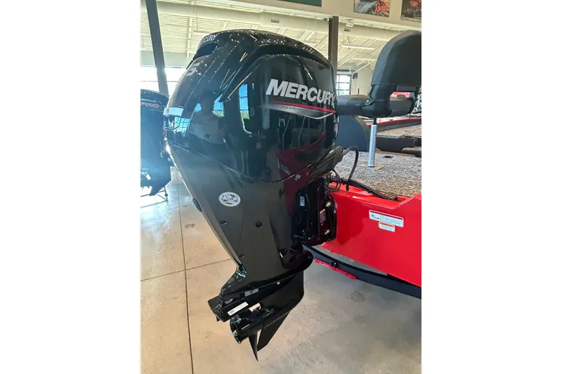 Slide: The Image of 2026 Tracker Pro Team 175 with Mercury outboard motor in showroom. - 7