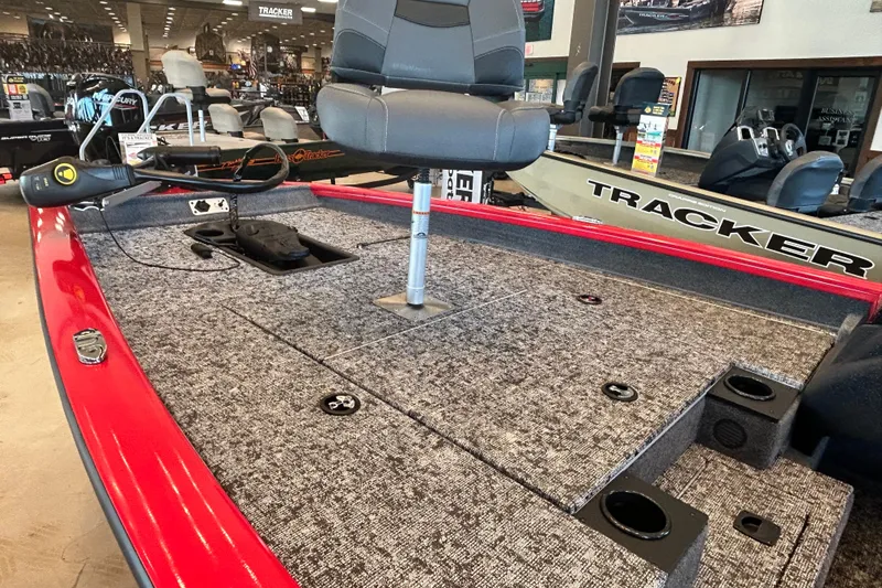 Slide: The Image of 2026 Tracker Pro Team 175 boat interior with seating and fishing equipment. - 13