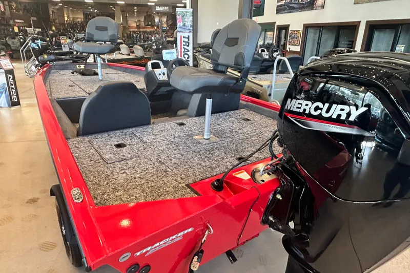 Slide: The Image of 2026 Tracker Pro Team 175 boat with Mercury engine in showroom. - 9