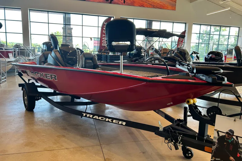 The Image of 2026 Tracker Pro Team 175 boat in showroom, red exterior, on trailer. - 0