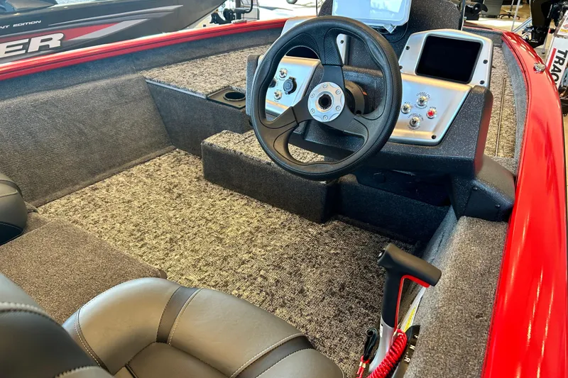 Slide: The Image of Interior of 2026 Tracker Pro Team 175 boat with steering wheel and controls. - 4