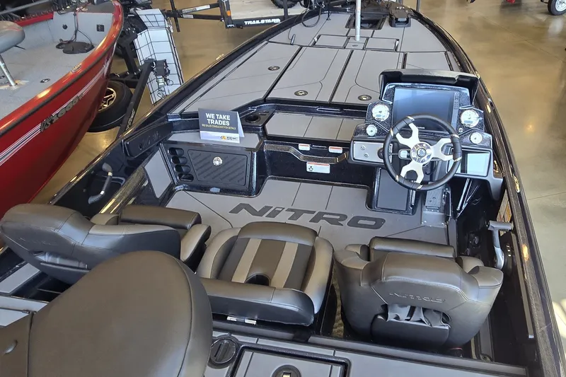 The Image of 2026 Nitro Z21 XL Pro boat interior with steering console and seating. - 0