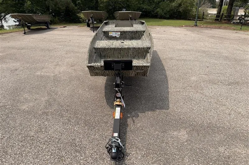 Slide: The Image of 2026 Tracker Grizzly 15 Jon boat on trailer in outdoor setting. - 2