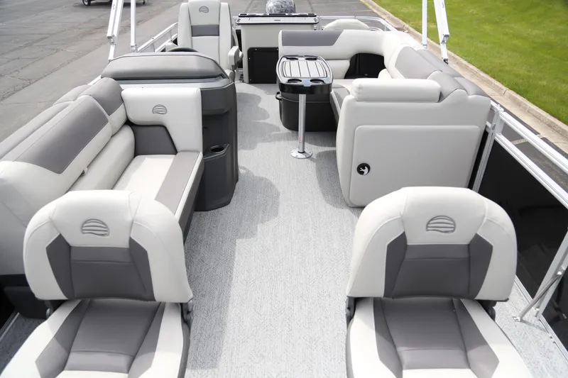 Slide: The Image of 2026 Sun Tracker Fishin' Barge 20 DLX interior with spacious seating and modern design. - 2