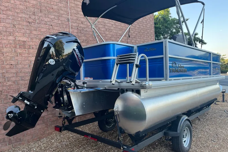 Slide: The Image of 2026 Sun Tracker Party Barge 18 DLX pontoon boat with Mercury outboard motor. - 5