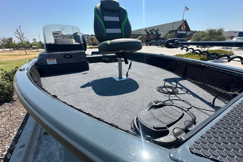 Slide: The Image of 2026 Ranger VS1782SC Angler boat with seating and control panel, parked outdoors. - 17