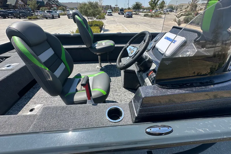 Slide: The Image of 2026 Ranger VS1782SC Angler boat interior with green-accented seats and steering console. - 18