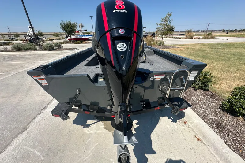 Slide: The Image of 2026 Ranger VS1782SC Angler boat with powerful outboard motor, parked outdoors. - 10