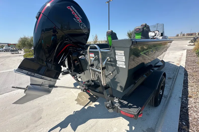Slide: The Image of 2026 Ranger VS1782SC Angler boat with Mercury Pro XS engine, parked outdoors. - 9