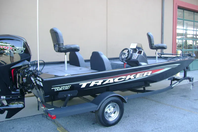 Slide: The Image of 2026 Tracker Pro Team 190 fishing boat on trailer, featuring sleek design and comfortable seating. - 2