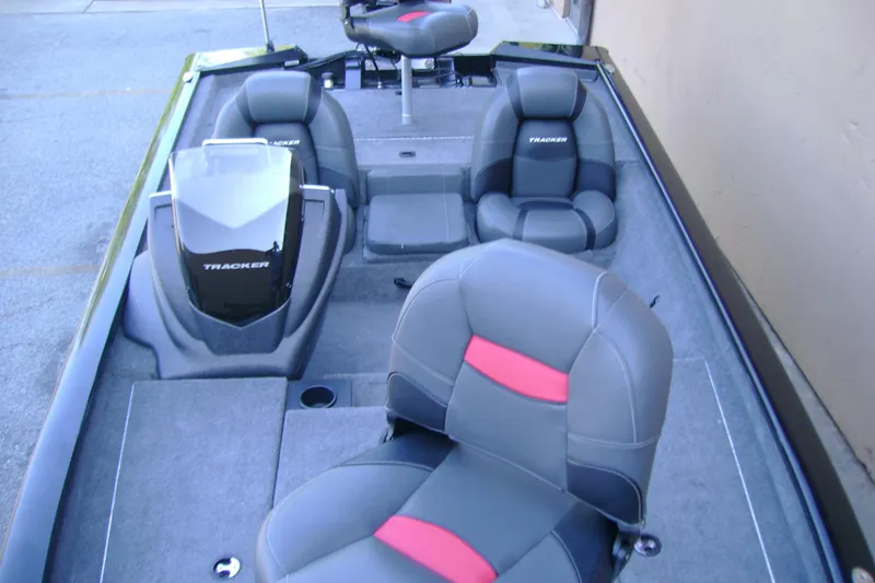 Slide: The Image of 2026 Tracker Pro Team 190 boat interior with gray and red seating. - 6