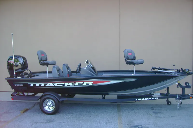 The Image of 2026 Tracker Pro Team 190 boat on trailer, featuring sleek design and modern seating. - 0