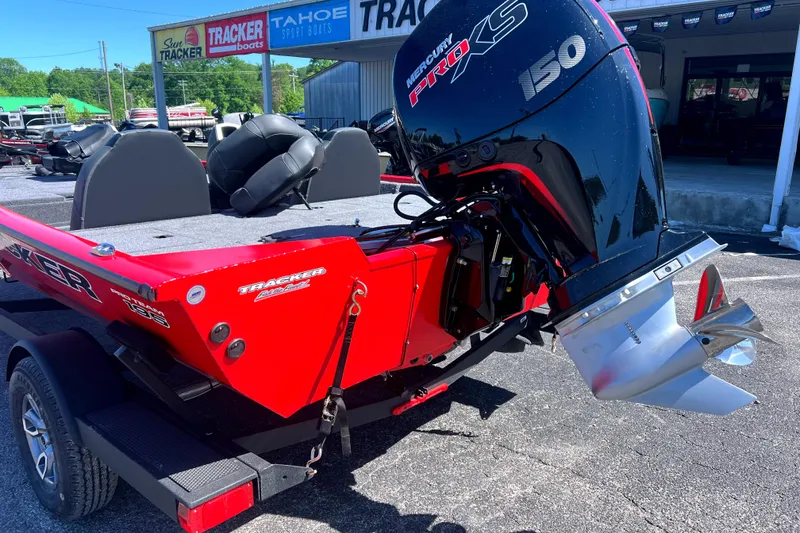 Slide: The Image of 2026 Tracker Pro Team 195 boat with Mercury Pro XS 150 engine, parked outdoors. - 3