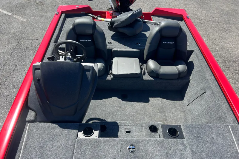 Slide: The Image of 2026 Tracker Pro Team 195 boat interior with dual seats and steering console. - 4