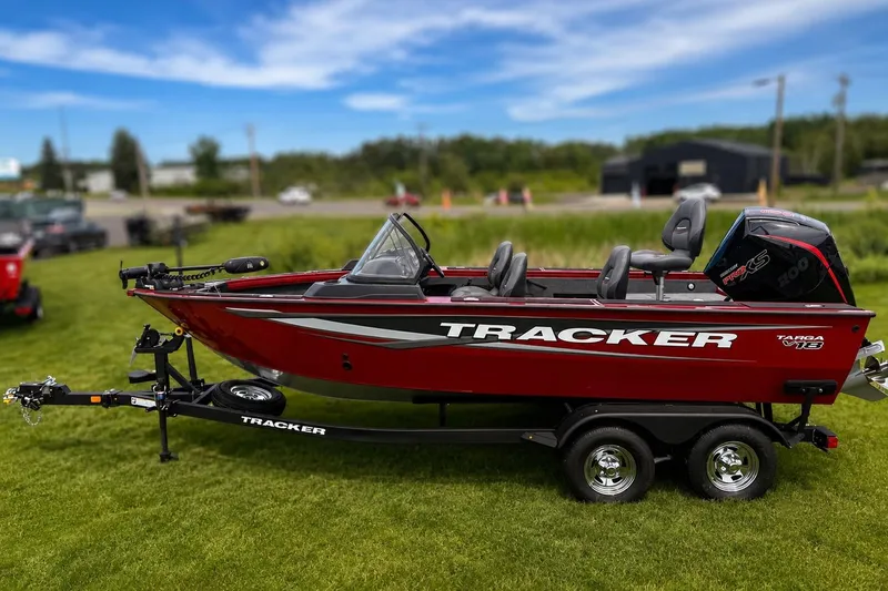 The Image of 2026 Tracker Targa V-19 Combo boat on trailer, parked on grass. - 0