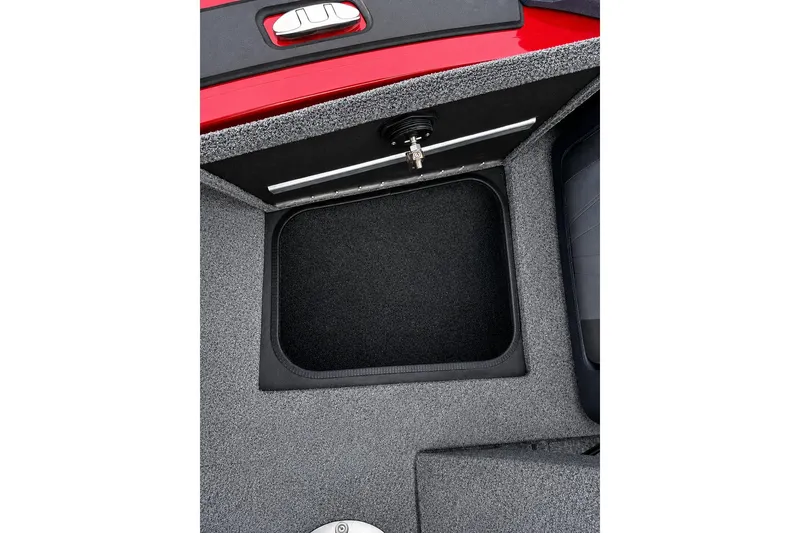 Slide: The Image of Storage compartment in 2026 Tracker Targa V-19 Combo boat, featuring a sleek, carpeted interior. - 11