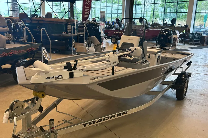 The Image of 2026 Tracker Bass Tracker Classic CC boat displayed in showroom with Minn Kota Maxxum motor. - 0